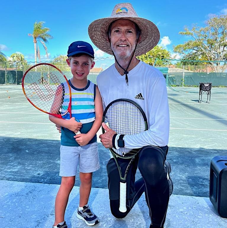 junior tennis player with tennis coach Steve Sawer